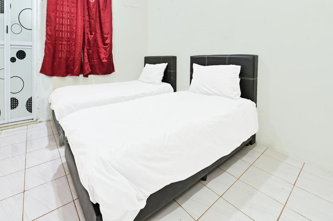 OYO 90596 Casaria Inn Paka Bagian luar foto